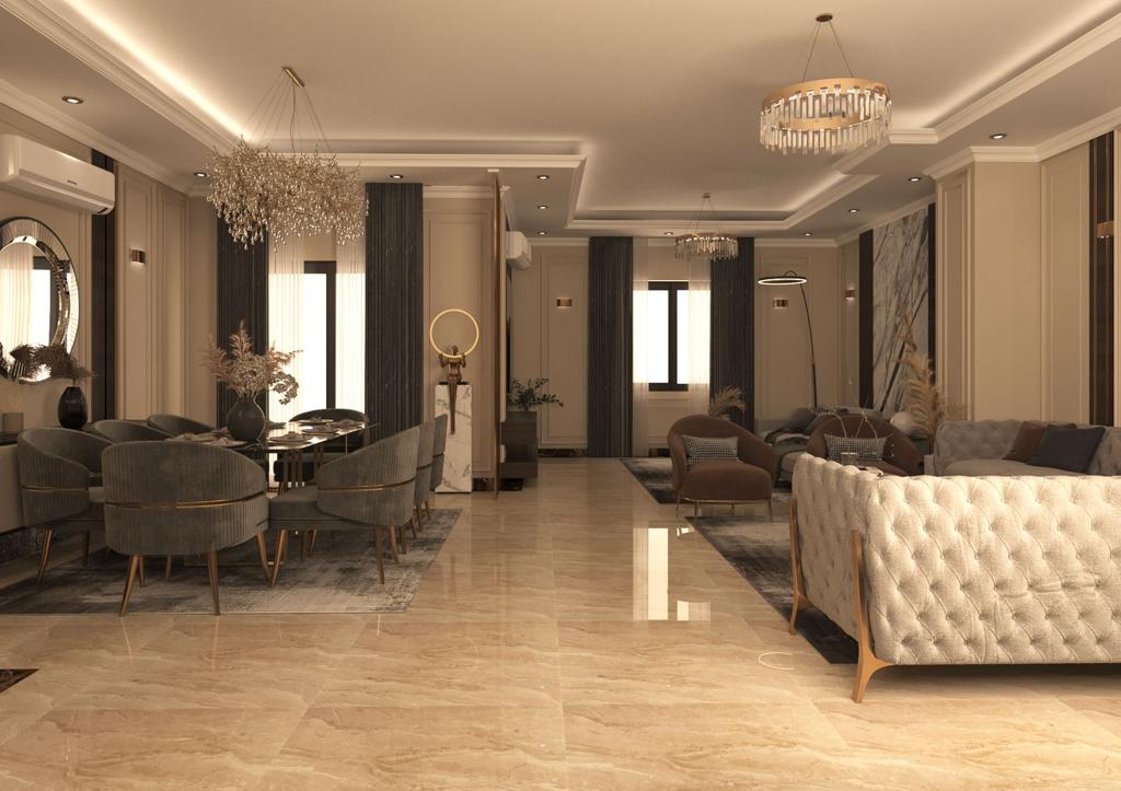 Wide view of the Villa R043 reception and dining area with statement chandeliers